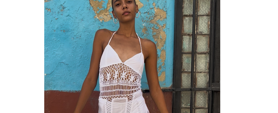 Model wearing AkoiaSwim crochet dress from Lyocell capsule collection – sustainable, soft, breathable, eco-friendly resortwear