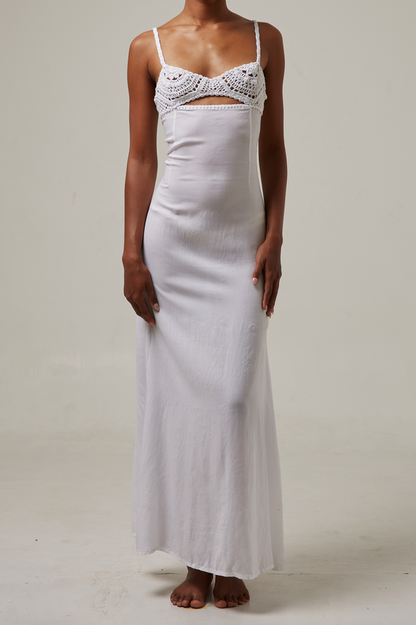 akoiaswim White slip dress with lace detailing on a plain background