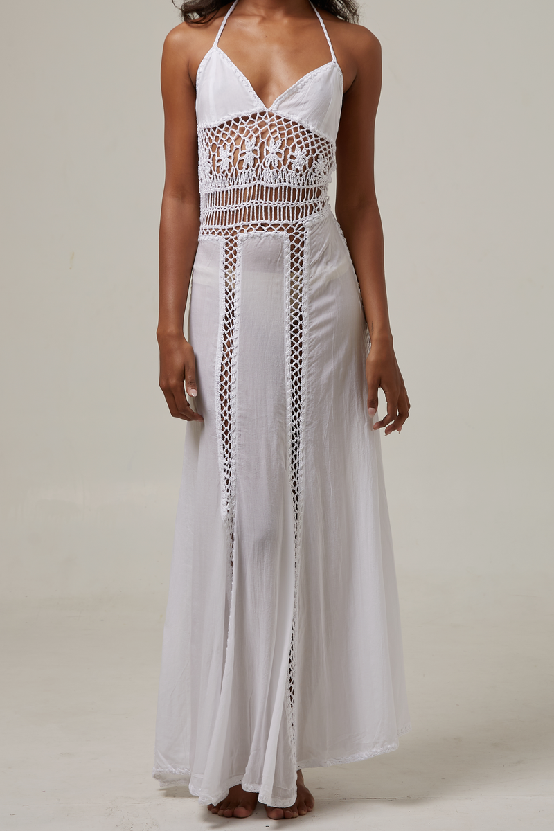 akoiaswim White dress with crochet details on a plain background